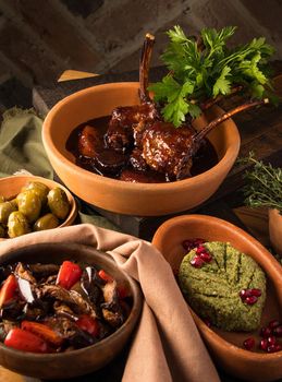 A vertical shot of a tasty appetizers and tomahawk steak