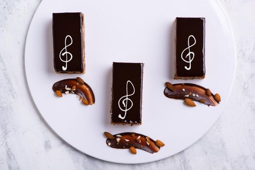 A serving of delicious chocolate cake pieces on a white plate