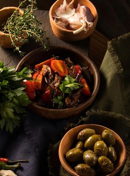 A vertical shot of a gourmet salad on a restaurant table