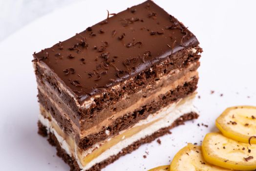 A serving of delicious chocolate cake pieces on a white plate