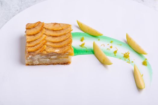 A serving of delicious fruit vanilla cake on a white plate