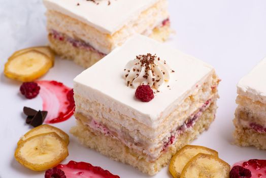 A serving of delicious fruit vanilla cake pieces on a white plate