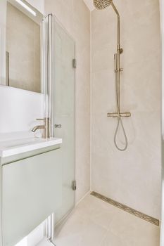 Modern shower stall in a bright bathroom