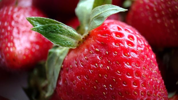 Texture or background. Macro composition of ripe juicy strawberries. Side view