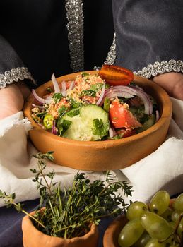 A vertical picture of a dish in hands