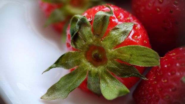 Macro composition of ripe juicy strawberries. Side view.Texture or background