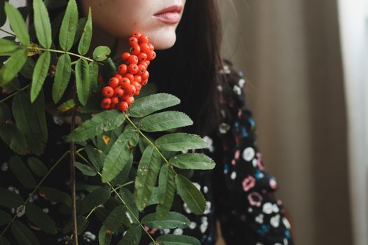 Beautiful sensual brunette woman with red lips makeup and long hair