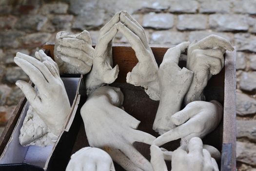 Many broken stone hands from the statue