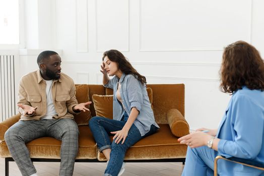 A diverse couple came to a session with a psychologist. Relationship problems, avoiding divorce.