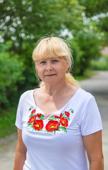 A Ukrainian woman in an embroidered shirt. Selective focus. vishivanka