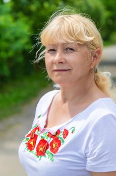 A Ukrainian woman in an embroidered shirt. Selective focus. vishivanka