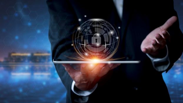 Cyber security network. Business man protecting data personal information on tablet. Padlock icon and internet technology networking connection on digital network background. Data protection privacy concept.