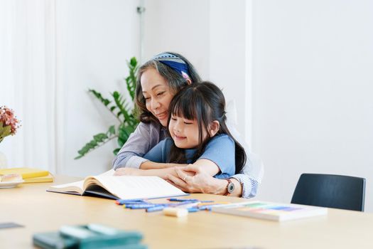 Asian portrait, grandchild granddaughter grandma grandmother and granddaughter happily join in activities to enhance skills for grandchildren.