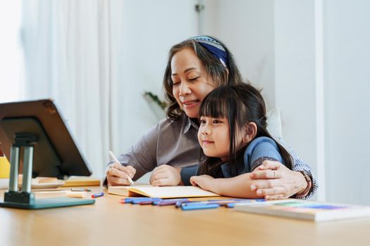 Asian portrait, grandchild granddaughter grandma grandmother and granddaughter happily join in activities to enhance skills for grandchildren.