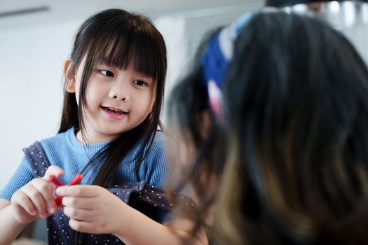 Asian portrait, grandchild granddaughter grandma grandmother and granddaughter happily join in activities to enhance skills for grandchildren.