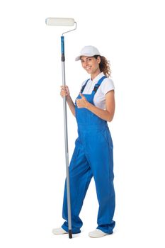 Female house painter in blue coveralls with paint roller tool isolated on white background