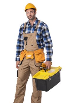 Contractor worker in coveralls and yellow hardhat with toolbox isolated on white background