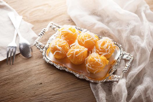 Toddy palm cake or Kanom Tan, Thai traditional dessert. Khanom tan is made from rice flour, ripe sugar palm fruit, coconut milk, scraped coconut, sugar and salt.