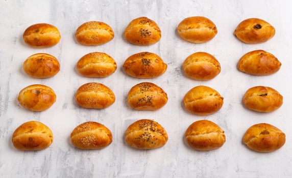 A top view of a number of tasty baked pastry on a table