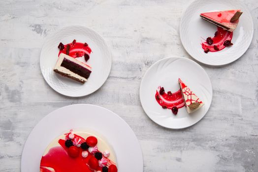 A top view of slices of tasty cake on white plates