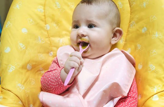 Baby is eating vegetable puree. Selective focus. Food.