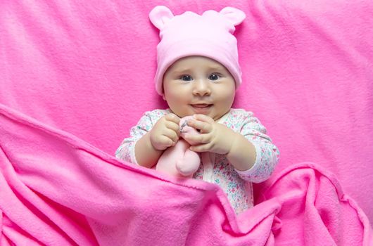 Baby sleeps with a bear. Selective focus. people.