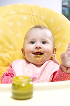 Baby is eating vegetable puree. Selective focus. Food.