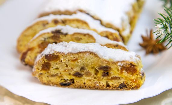 Stollen Christmas cake on the table. Selective focus. Food.