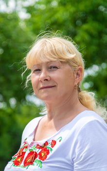 A Ukrainian woman in an embroidered shirt. Selective focus. vishivanka