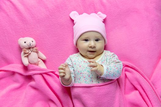 Baby sleeps with a bear. Selective focus. people.