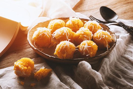 Toddy palm cake or Kanom Tan, Thai traditional dessert. Khanom tan is made from rice flour, ripe sugar palm fruit, coconut milk, scraped coconut, sugar and salt.