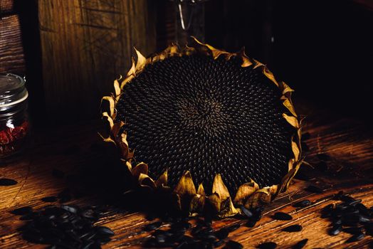 Dried sunflower and roasted seeds on the old wooden table