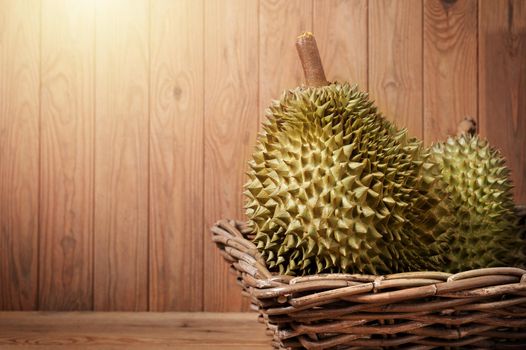 Mon Thong durian fruit on wooden plank background. Regarded by many people in southeast asia as the king of fruits.