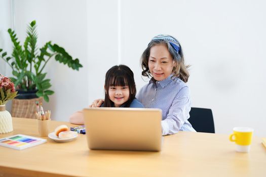 Asian portrait, grandchild granddaughter grandma grandmother and granddaughter happily join in activities to enhance skills for grandchildren.