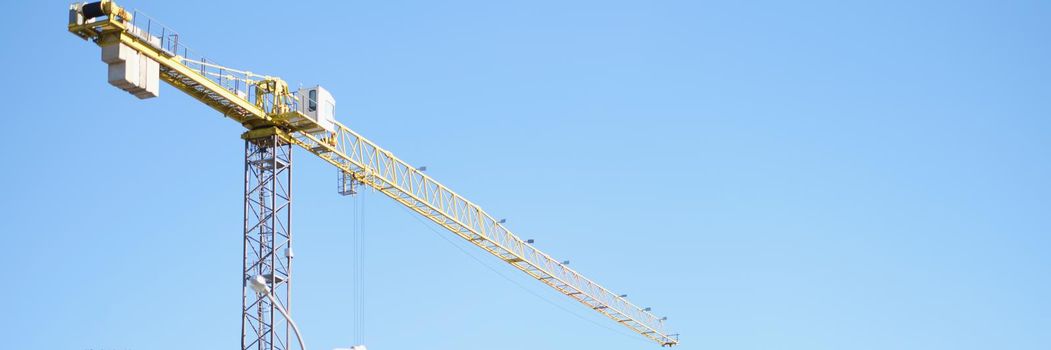 Close-up of big construction site include several cranes working on building complex. Project for corporation building. Industry building business concept