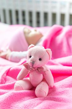 Baby sleeps with a bear. Selective focus. people.