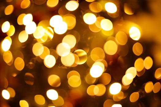 Close-up newyear tree blurred background with bokeh lights.