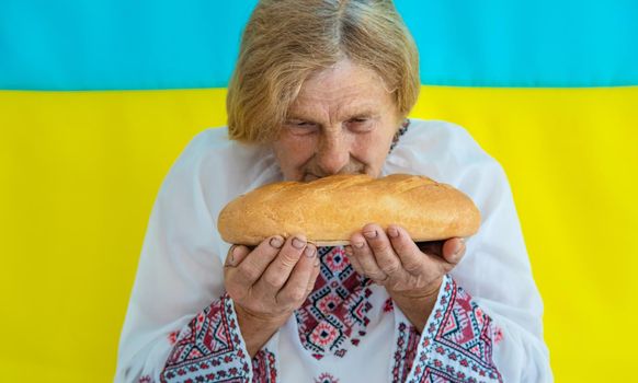 Grandmother is a Ukrainian patriot in an embroidered shirt. selective focus. People.