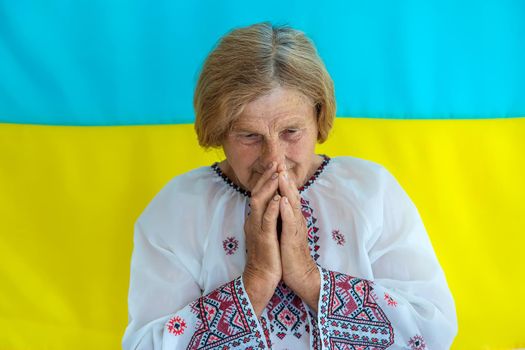 Grandmother is a Ukrainian patriot in an embroidered shirt. selective focus. People.