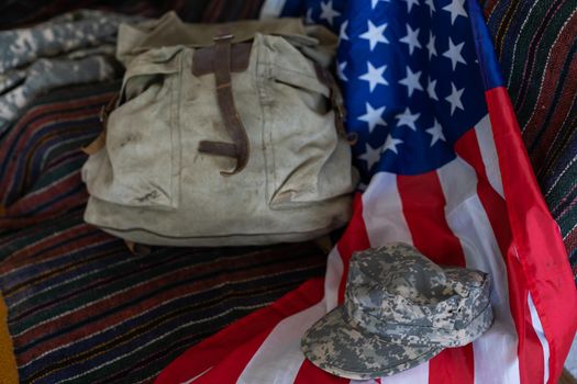 Military backpack and american flag.