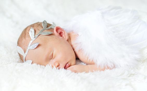 Newborn angel photo session in a suit. Selective focus. people.