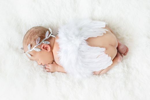 Newborn angel photo session in a suit. Selective focus. people.