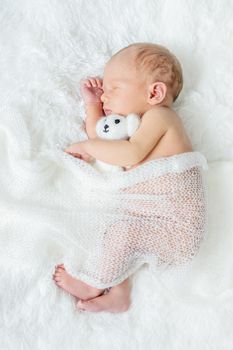 Newborn baby sleeping on a white background. Selective focus. people.