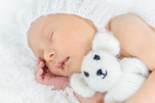 Newborn baby sleeps in a hat. Selective focus. people.