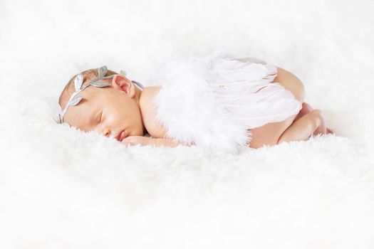 Newborn angel photo session in a suit. Selective focus. people.