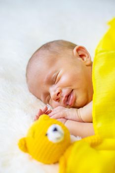 Newborn baby sleeping on a white background. Selective focus. people.