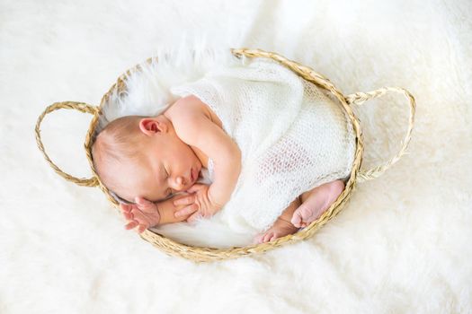 Newborn baby sleeping on a white background. Selective focus. people.