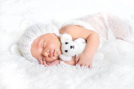 Newborn baby sleeps in a hat. Selective focus. people.