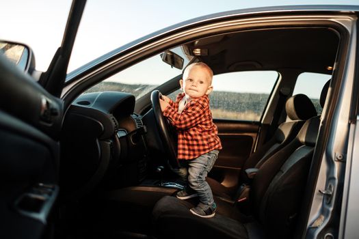 Portrait of a One Little Boy Playing with Car