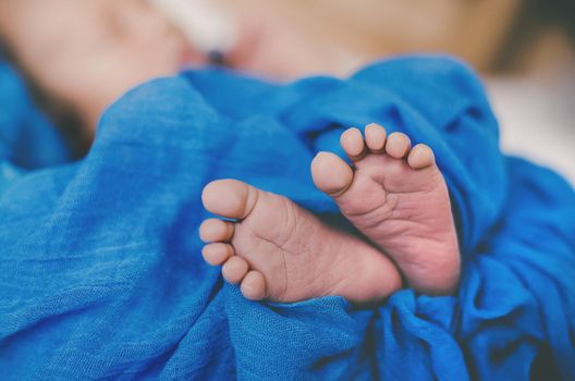 Newborn baby sleeping on a blue background. Selective focus. people.